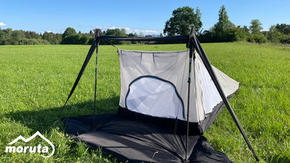 Moruta tent pitched in a picturesque mountain landscape, perfect for adventurous hikers and bikepackers seeking durable and reliable shelter.